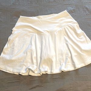 White skirt with built in shorts. New, never worn. Smoke free home
